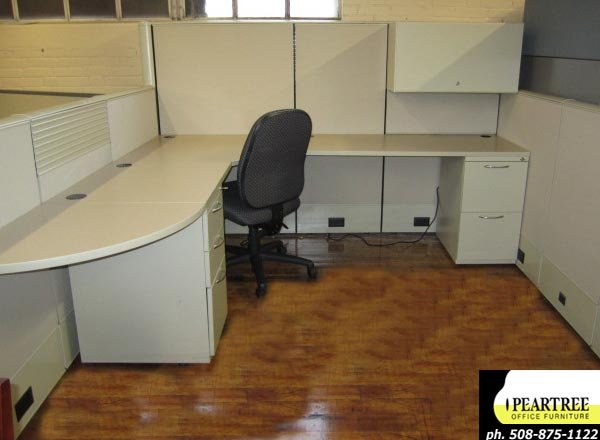 AIS Matrix beige cubicles with multiple height panels, shared teaming tables, overheads, pedestal files and rail tiles.