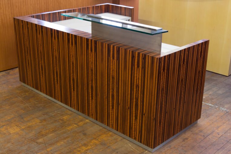 Custom Low Profile Tiger Wood Reception Desk from the feature film "Basic Math"